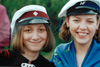 Studentahúgvan vinstru megin og HF húgvan høgru megin / Studenten til venstre og HF'eren til højre / The student with the red/black banded cap in the left and the girl with Higher Preparatory Examination with the black/blue banded cap in the right. 